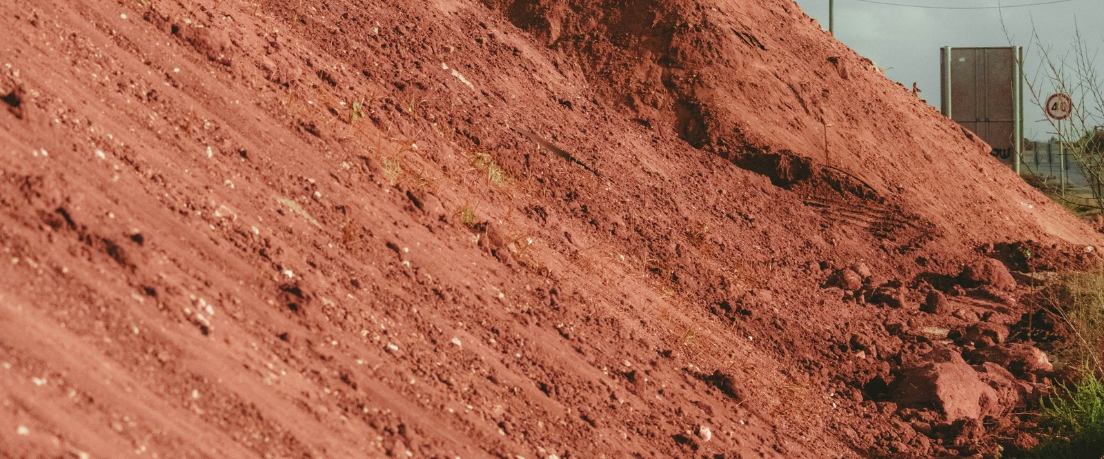 Red earthworks soil on an AX Civil job site